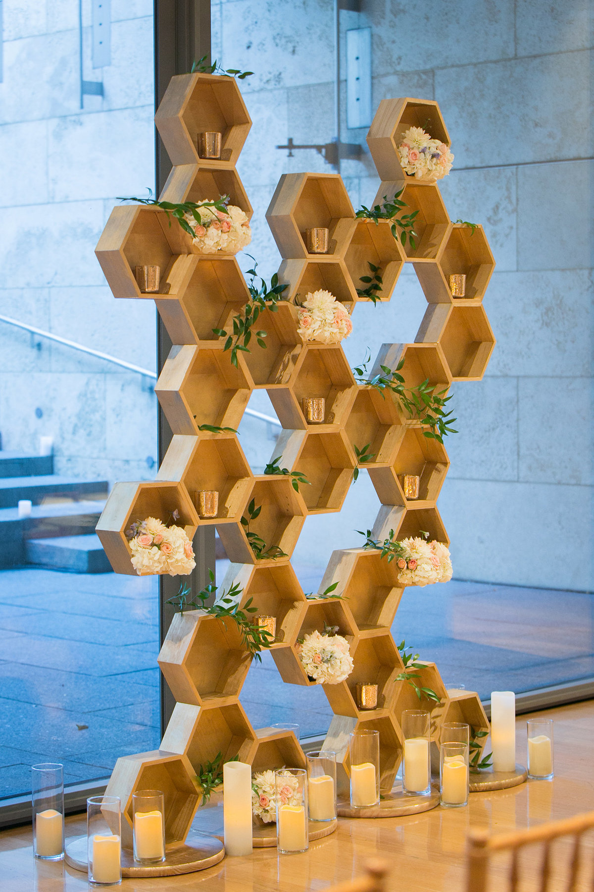 Modern geometric backdrop with greenery at a contemporary venue